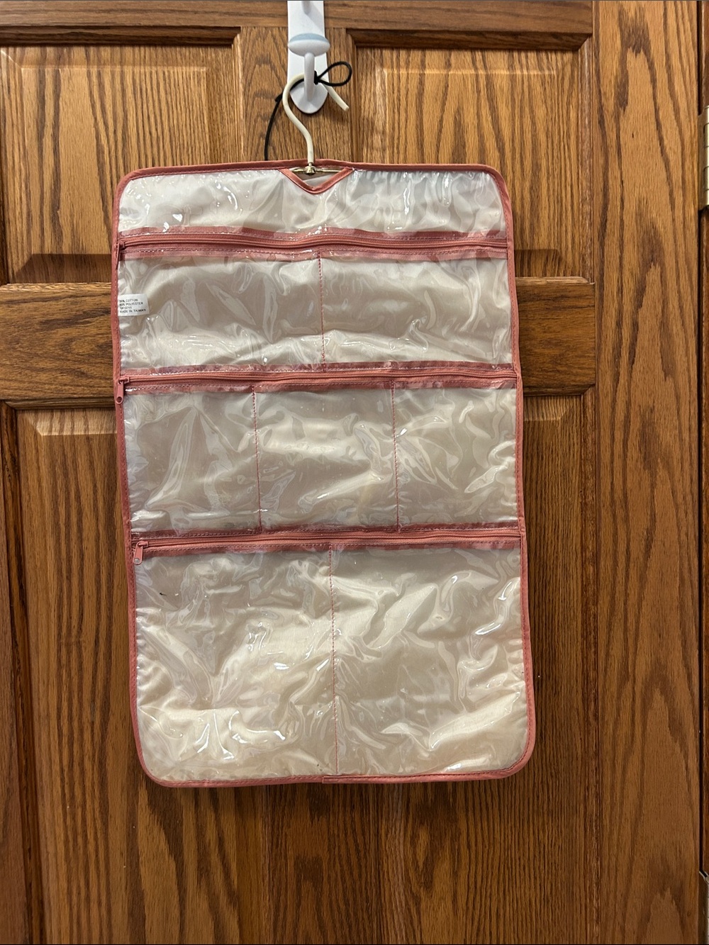 This type of hanging roll-up travel toiletry bag or jewelry organizer